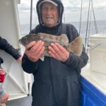a person holding a fish