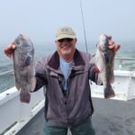a man holding a fish