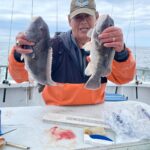 a person holding a fish