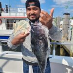 a man holding a fish