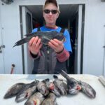 a person holding a fish