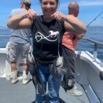 a couple of people that are standing in a body of water