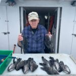a man holding a fish