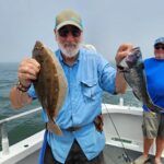 a man holding a fish