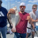 a person holding a fish