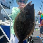 a person holding a fish