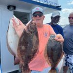 a man holding a fish