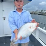 a man holding a fish