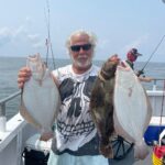 a man holding a fish