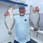 a man holding a fish