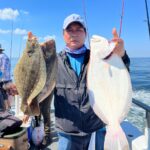 a person holding a fish