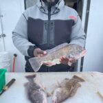 a man holding a fish