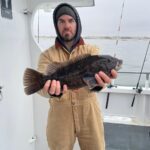 a person holding a fish