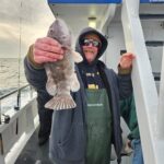 a person standing next to a boat