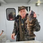 a person standing next to a bus