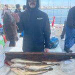 a man holding a fish