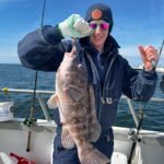 a person holding a fish
