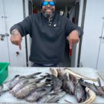 a person holding a fish