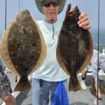 a man holding a fish
