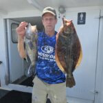 a man holding a fish