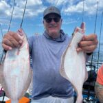 a man holding a fish