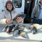 a woman holding a fish