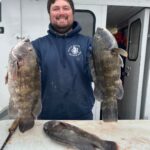 a man holding a fish