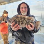 a person holding a stuffed animal