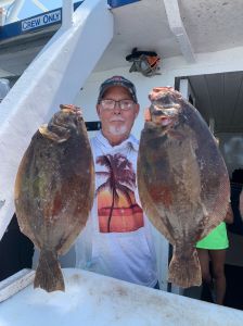 a man holding a fish