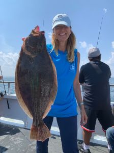 a person holding a fish