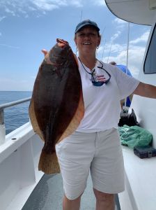 a man holding a fish