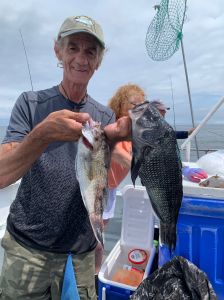 a man holding a fish