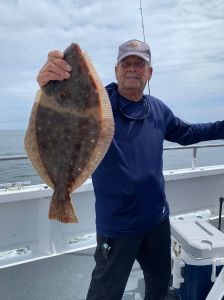 a man holding a fish