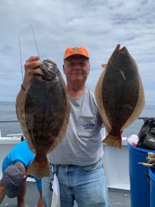 a man holding a fish