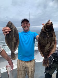 a man holding a fish