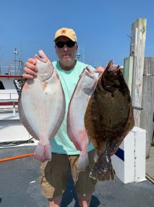 a man holding a fish