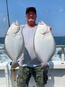 a man holding a fish