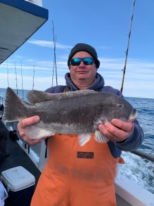 a man holding a fish