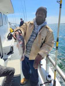 a man holding a fish