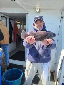 a person holding a fish