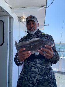 a man holding a fish