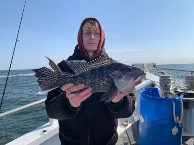 a person holding a fish in the water