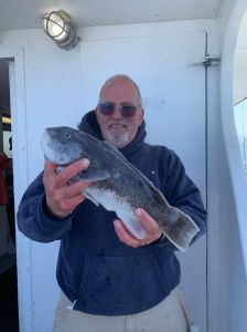 a man holding a fish