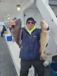 a man holding a fish