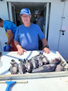 a man holding a fish