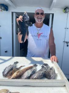 a man holding a fish