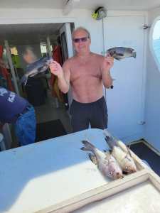 a person holding a fish