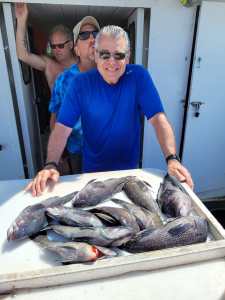 a man holding a fish