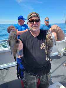 a man holding a fish