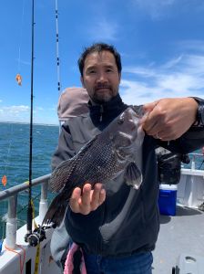 a man holding a fish